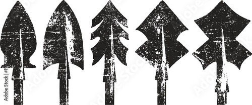 set of ancient stone arrowheads with various shapes and textures for hunting and craftsmanship