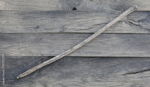 Tableau sur toile ancient wooden spear on a wooden background