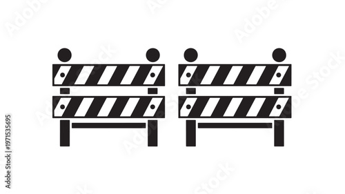 Barricades with diagonal stripes and top spheres used for construction or traffic control featuring barricade, barrier, safety with road and warning