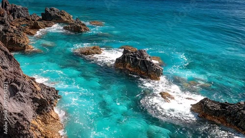 Serene Coastal View with Turquoise Waters and Rocks