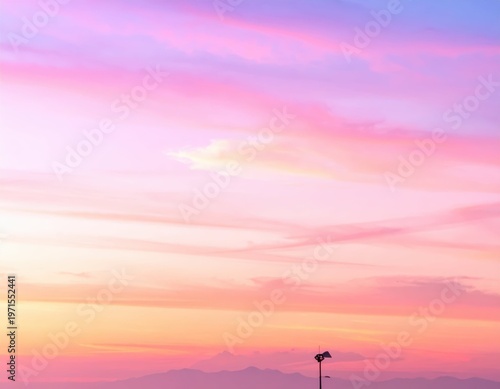 Serene Sunset Over Mountains with Vibrant Pink and Purple Sky