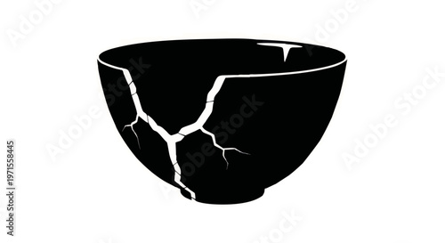 Cracked black bowl with visible fractures and smooth surface