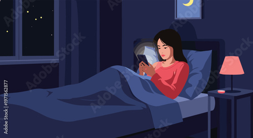 Young woman using her smartphone while lying in bed late at night with soft light from a lamp and moonlight in the window.