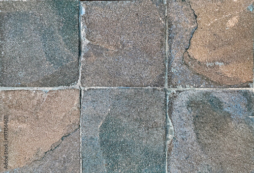 Tableau sur toile Unique natural rough slate stone wall texture in mix of brown, terracotta, blue, and grey with random abstract veins