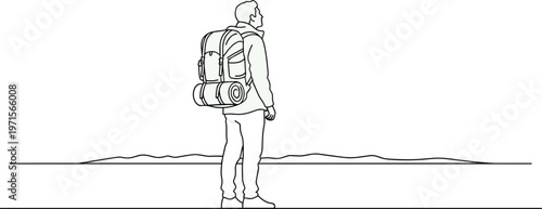Backpacker standing on horizon looking into distance with backpack and sleeping bag.