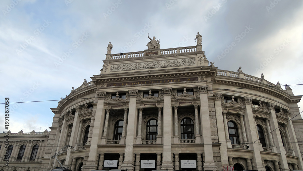 Obraz premium Vienna, Austria. The Burgtheater originally known as K.K. Theater an der Burg, then until 1918 as the K.K. Hofburgtheater, is the national theater.