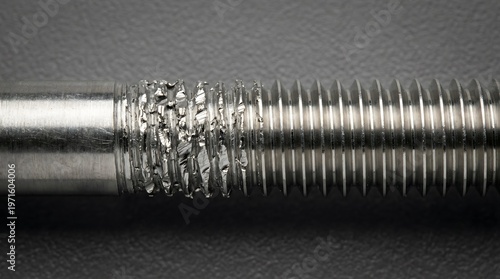Detailed view of a metal bolt showing corrosion and wear dilution refrigerator, cryostat, cryogenic hardware, quantum cooling system, millikelvin background, copy space