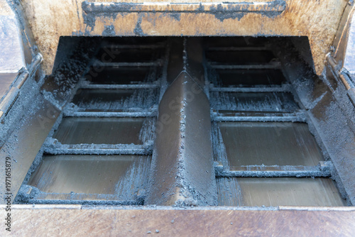 Photos Heavy machinery interior shows worn metal structure