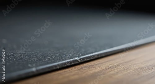 Detailed focus on a textured surface isolated against a soft, uniform background. Extreme shallow depth of field creates significant bokeh blur and abstraction, blank, foreground, close-up