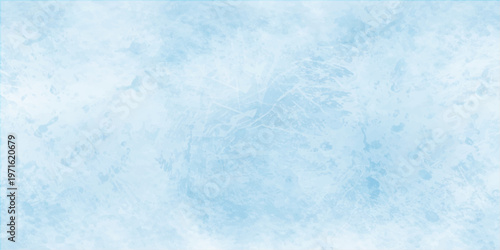 Abstract blue grunge background with a frozen winter texture featuring white frost patterns and cold clouds under a bright heaven sky