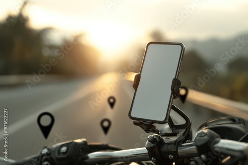 Smartphone on motorcycle handlebar at sunset
