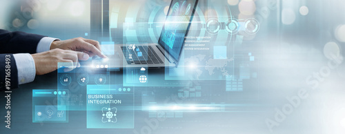 Cuadro en lienzo Businessman using laptop to analyze and control business integration data