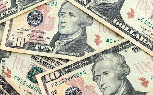 Wallpaper Mural US ten dollar money banknotes pile on table. United States bills of USD currency close up Torontodigital.ca