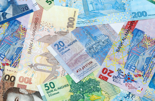 Moroccan dirham money banknotes pile on table. Morocco bills of MAD currency close up