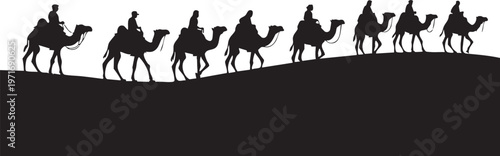 Silhouette of people riding camels across a desert landscape