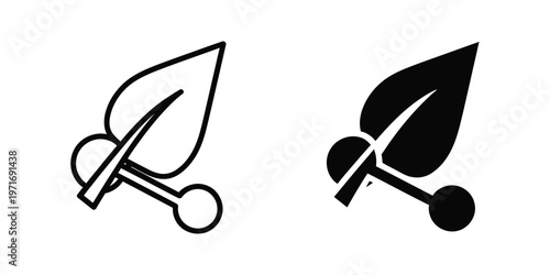 Scissors icon with contrasting black and white leaf designs