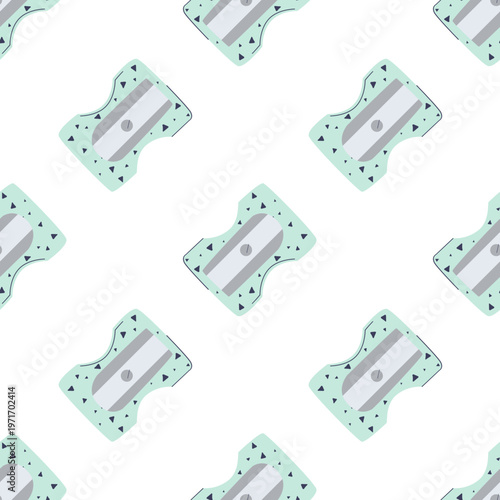 A repeating pattern of mint green pencil sharpeners with small dots