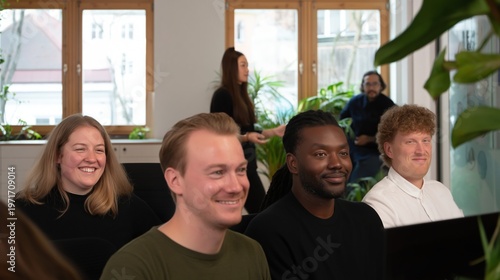 Group of coworkers smiling and enjoying presentation, relaxed work environment, diversity, teamwork, learning, office, company, positive mood