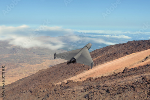 Obraz na plátne UAV performs reconnaissance in mountainous military conflict risk zone