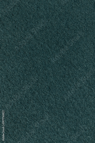 Detailed texture of dark teal wool fabric. Top view close-up of a soft, thick material. Background shot, suitable for both horizontal and vertical use.