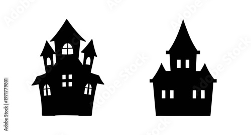 Two black silhouette haunted houses with towers and windows