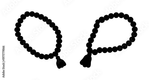Two black malas or prayer beads with tassels