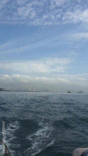Cityscape of Panama City, Panama and boats in the harbor. Vertical video.
