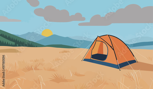 Camping at sunrise in a field with mountains and a tent in the background