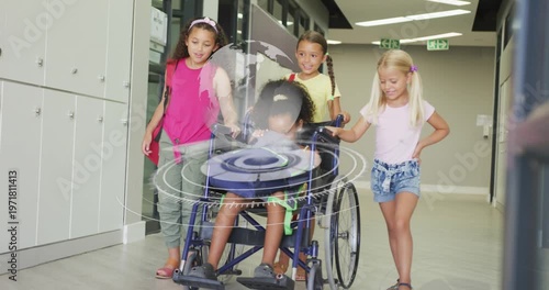 Vertical video: Four girls pushing wheelchair along hall, activating AR globe on chair in education