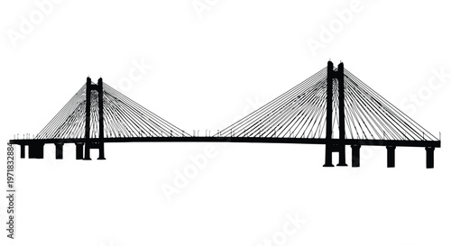 Suspension bridge with cables and towers spanning a river valley