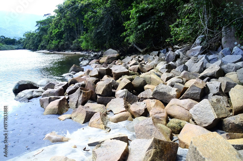 The beauty of the rocks at Mococa beach, in Caraguatatuba, on the north coast of São Paulo state, on a sunny weekday.