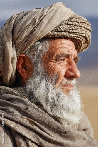 Elderly tribal man wearing turban showing wisdom and experience