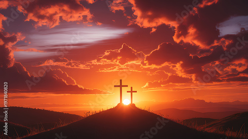 Three crosses on a hill at sunset