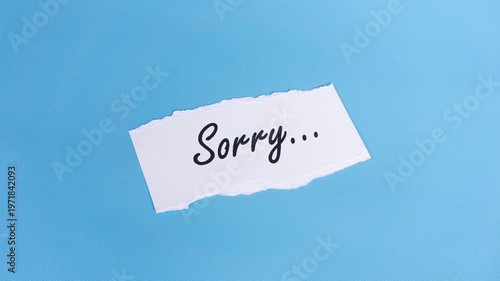 Photography Sorry message on a paper with blue background