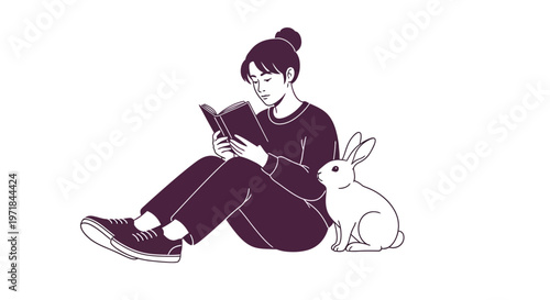 Young woman reading book next to cute white rabbit