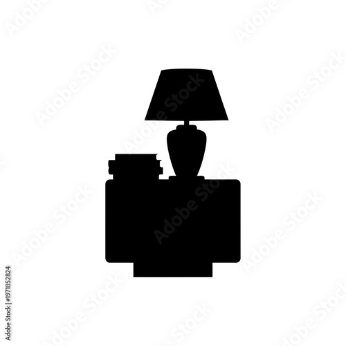 Shadowed Serenity: A bedside table with a lamp and stack of books create a serene ambiance, casting intriguing shadows and inviting contemplation.