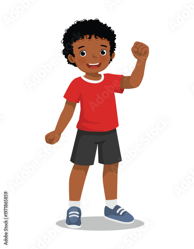 Little African boy showing win fist up expression gesture feeling proud with victory
