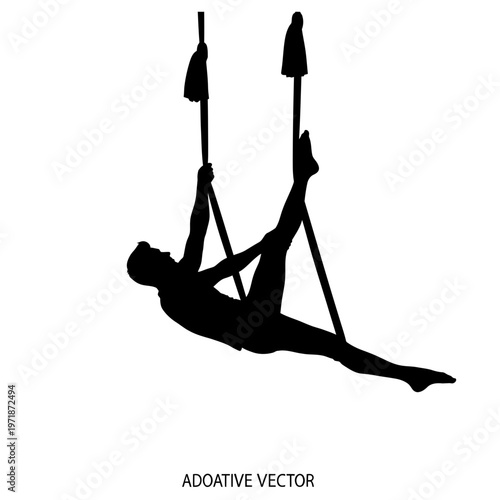 Aerial Acrobat Silhouette: A captivating silhouette of an aerial acrobat gracefully performing a poised and elegant routine on hanging fabric, suspended against a clean backdrop, showcasing strength.