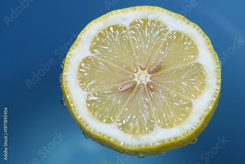 A half of a lemon in a glass of water