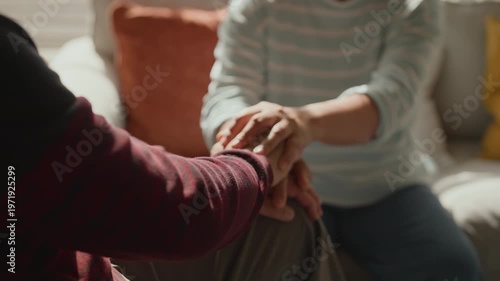 Old Asian senior couple showing love and support, woman holding hands of sick man in wheelchair, caregiving, encouragement, bonding and compassion, uplifting family moment, strength, hope and resilien
