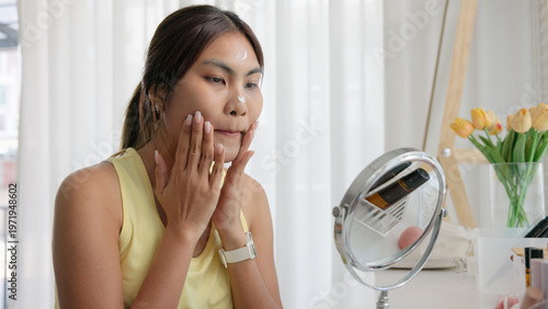 Fotografía Young adult woman gen z black asia people relax get ready prepare clean makeup apply cream skin care make up getting dressed at home