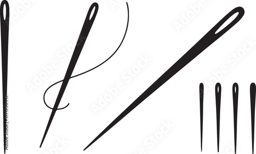 Sewing needles with thread and multiple eye needles.