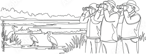 People birdwatching in nature reserve
