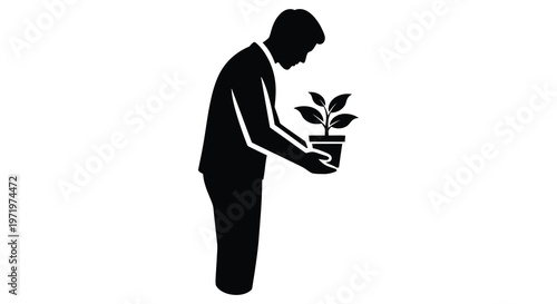 Man gently tending to a small plant a hopeful visual silhouette