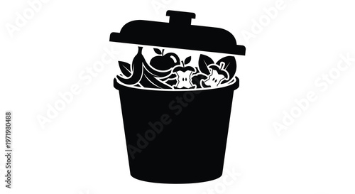 Trash can overflowing with fruit scraps a stark black silhouette