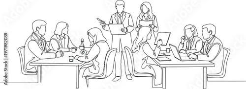people sitting at desks working together