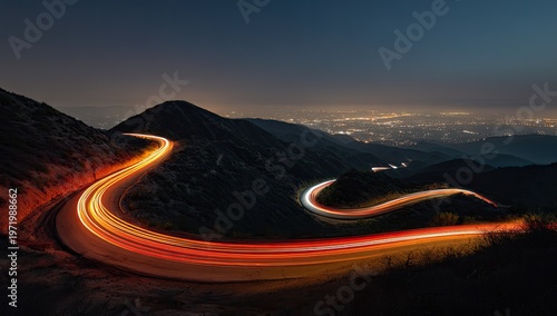 Winding mountain road with light trails from vehicles at night