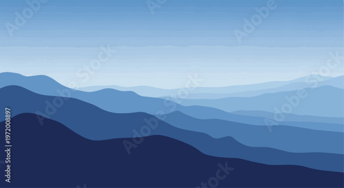 Abstract layered mountain range in shades of blue against a clear sky