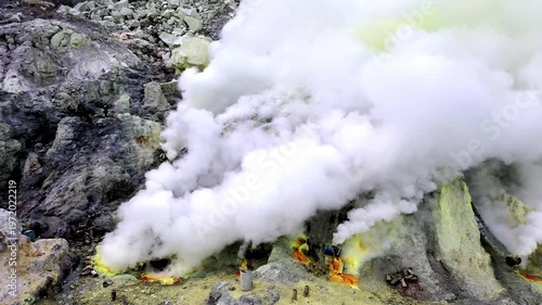 Breathtaking Close Up Drone Footage of Heavy White Clouds And Toxic Fumes. Billowing Out From Active Crater of Kawah Ijen in East Java Indonesia. Aerial View Dramatic And Mysterious Atmosphere 4k