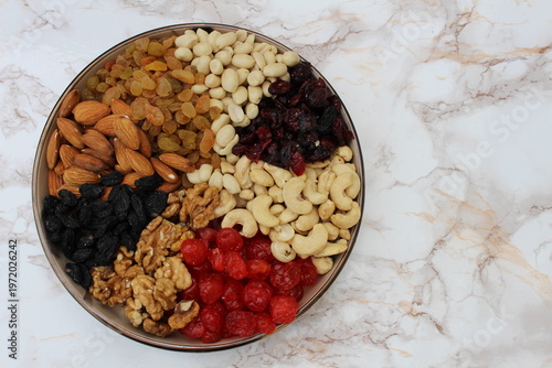 a mixture of nuts and dried fruits on the table in a plate